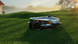 Sunseeker X4 robot lawn mower cutting grass on a lawn at sunrise