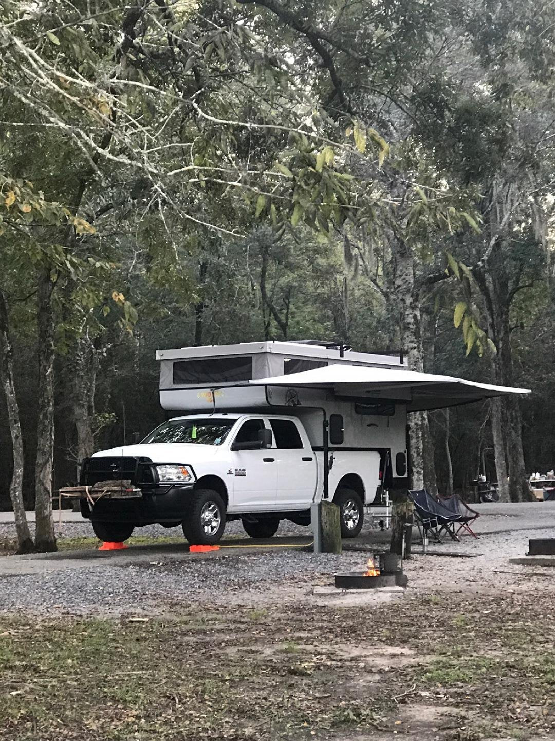 BunduAwn L-Shaped 270 awning installed on truck camper — rear and side coverage