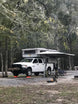 BunduAwn L-Shaped 270 awning installed on truck camper — rear and side coverage