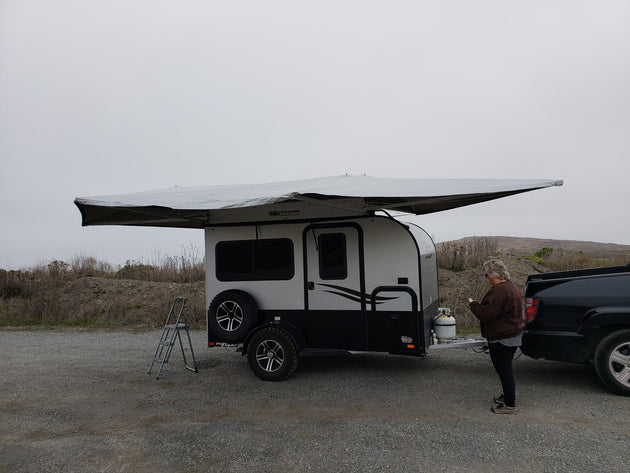 BunduAwn Standard 360 awning fully deployed on a NOBO trailer — three-sided wrap-around coverage