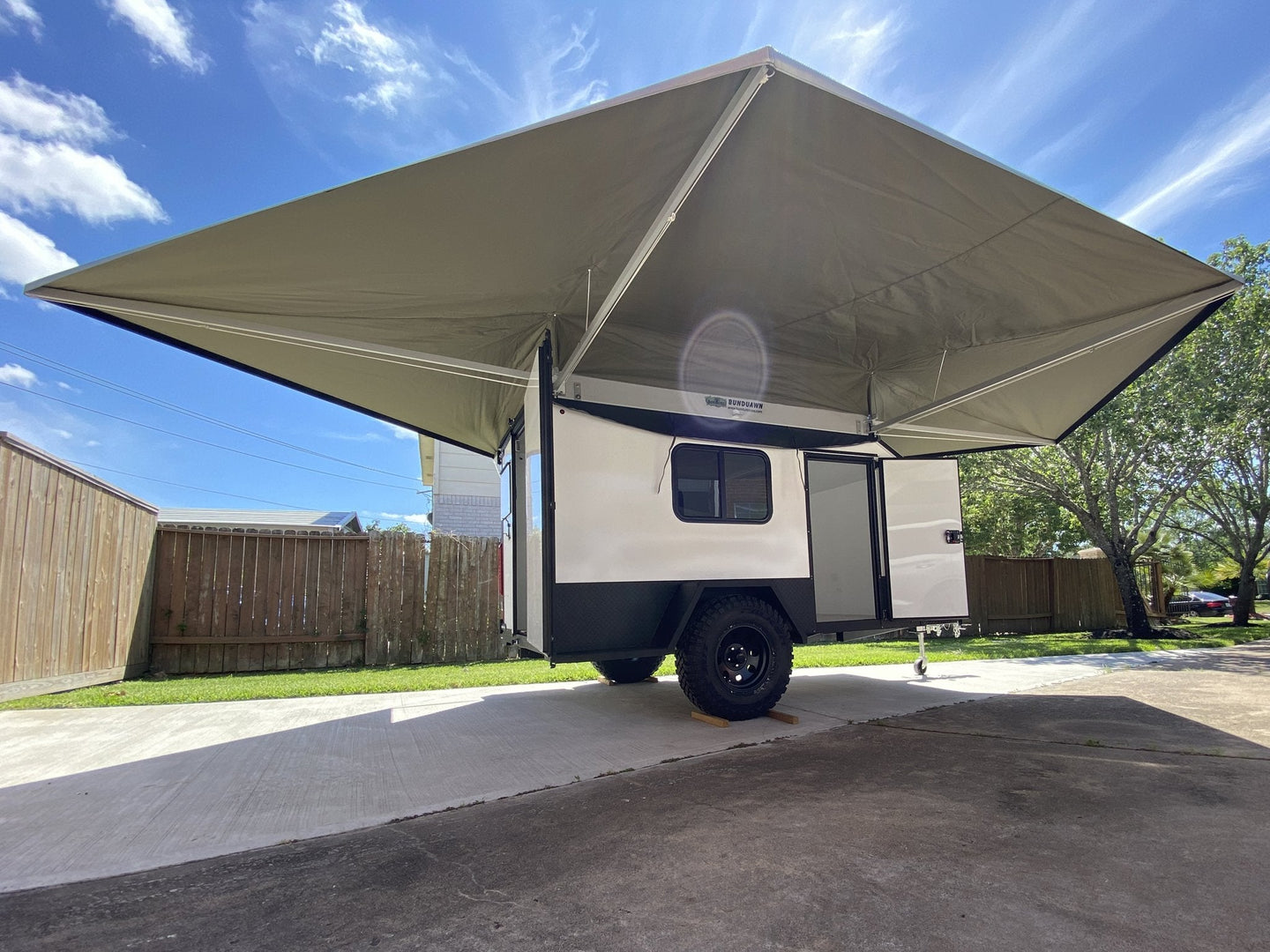 BunduAwn 360 8ft awning deployed on overland trailer at camp