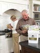 Legacy Food Storage 2160 Serving Package lifestyle photo of a man reading a meal pouch label