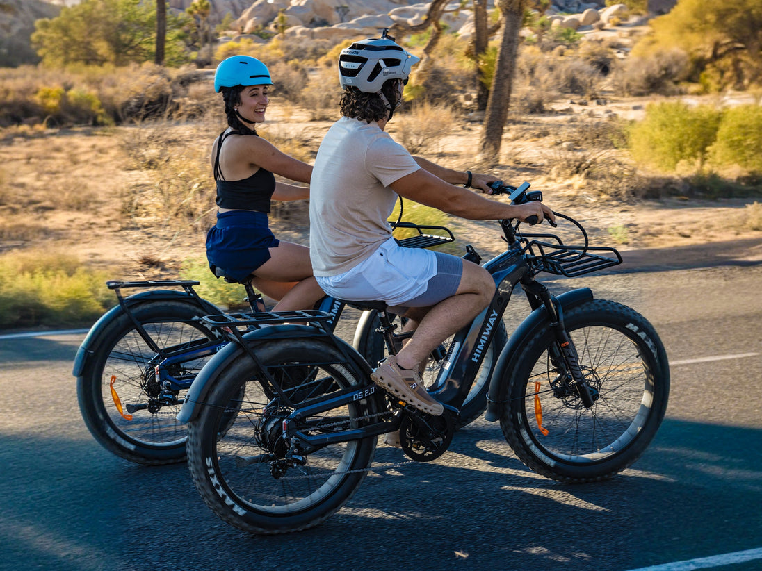 Riders on Himiway D5 2.0 e-bikes on a desert road