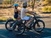 Riders on Himiway D5 2.0 e-bikes on a desert road
