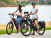 Riders on Himiway A7 e-bikes by a lake