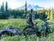 Himiway D5 2.0 Camo e-bike with a gear trailer in a mountain meadow