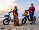 Two riders with Himiway D5 2.0 20 inch e-bikes at the beach
