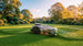 Sunseeker X5 Gen2 robot lawn mower mowing a lawn at golden hour