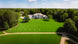 Aerial view of a large lawn cut in stripes by the Sunseeker X7 Gen2