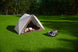 Sunseeker X7 Gen2 mowing beside a family tent in the backyard