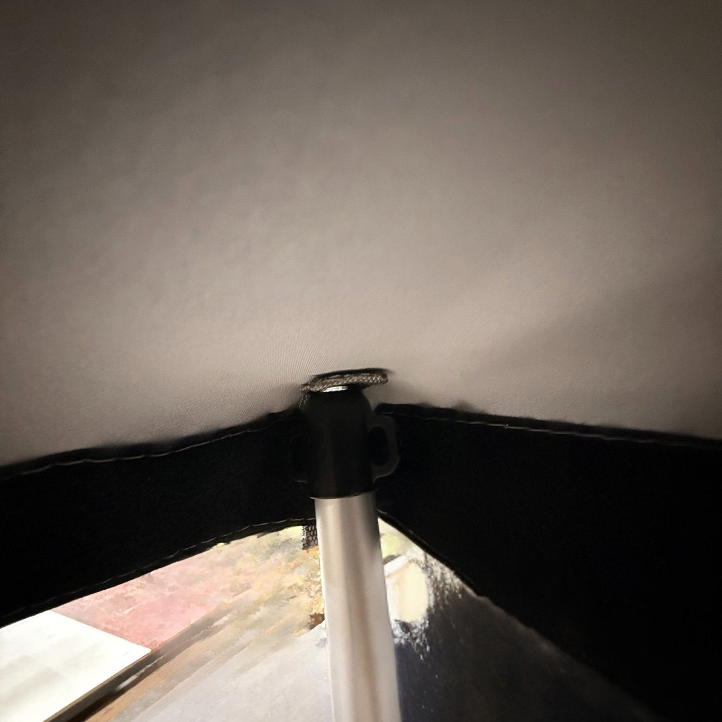 Triangle panel pole grommet detail
