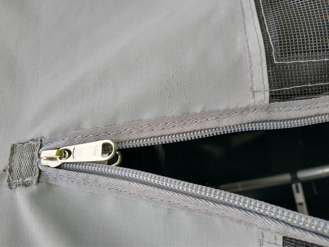 Velcro entrance cover panel with center zipper entry