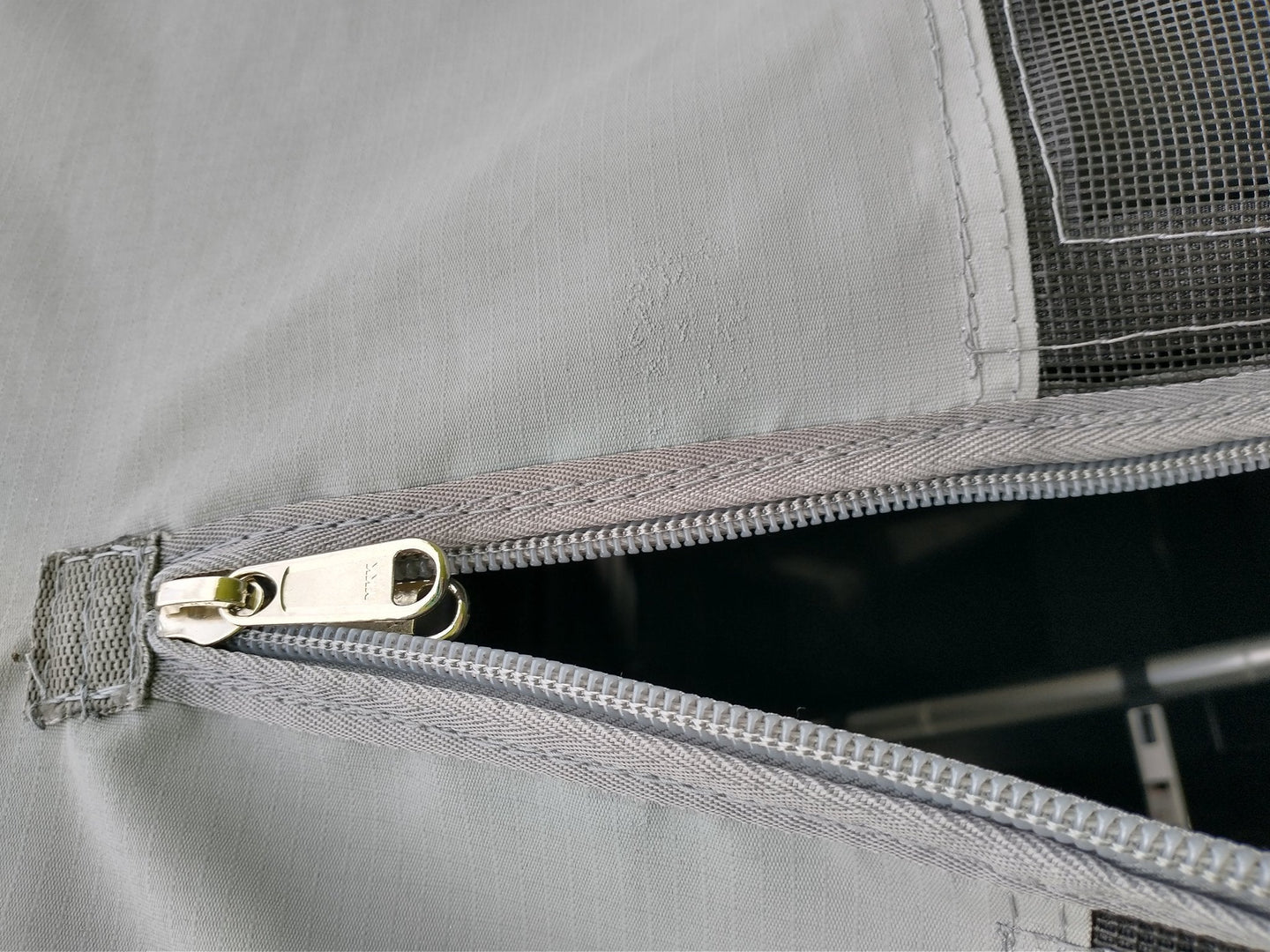 Velcro entrance cover panel with center zipper entry
